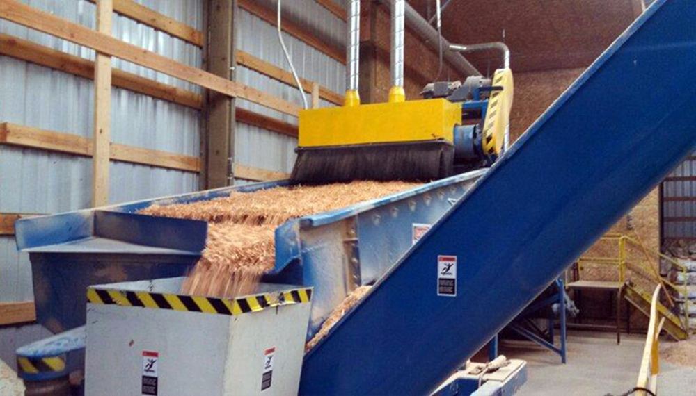 Shavings on the conveyor at the Jim Thorp Lumber sawdust plant